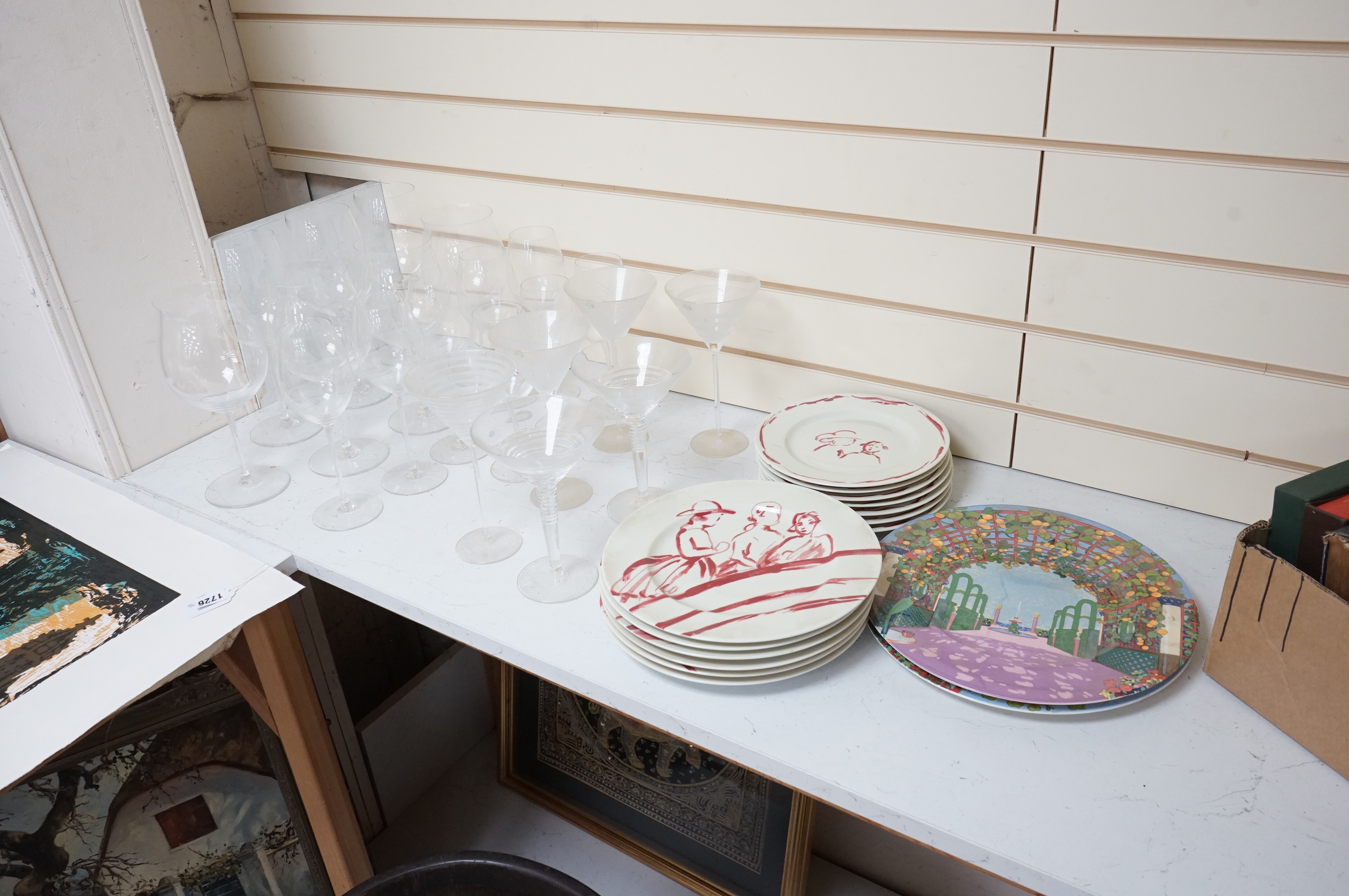 A Pierre Frey ‘Gonesse’ Limoges part dinner service, two Villeroy and Boch ‘Jardins Francais’ dinner plates, with a collection of Riedel wine glasses and mixed Salviati champagne glasses. Villeroy and Boch plates 30.5cm